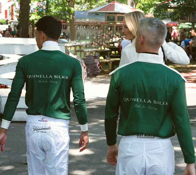 Jockey racing in custom silks